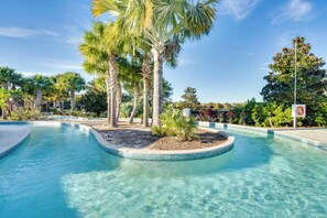 A clear swimming pool surrounded by palm trees and a sign indicating no diving. - 13 Mi to WDW: Family Home w/ Private Pool & Perks! (Kissimmee)