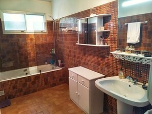Shower, hair dryer, towels, toilet paper