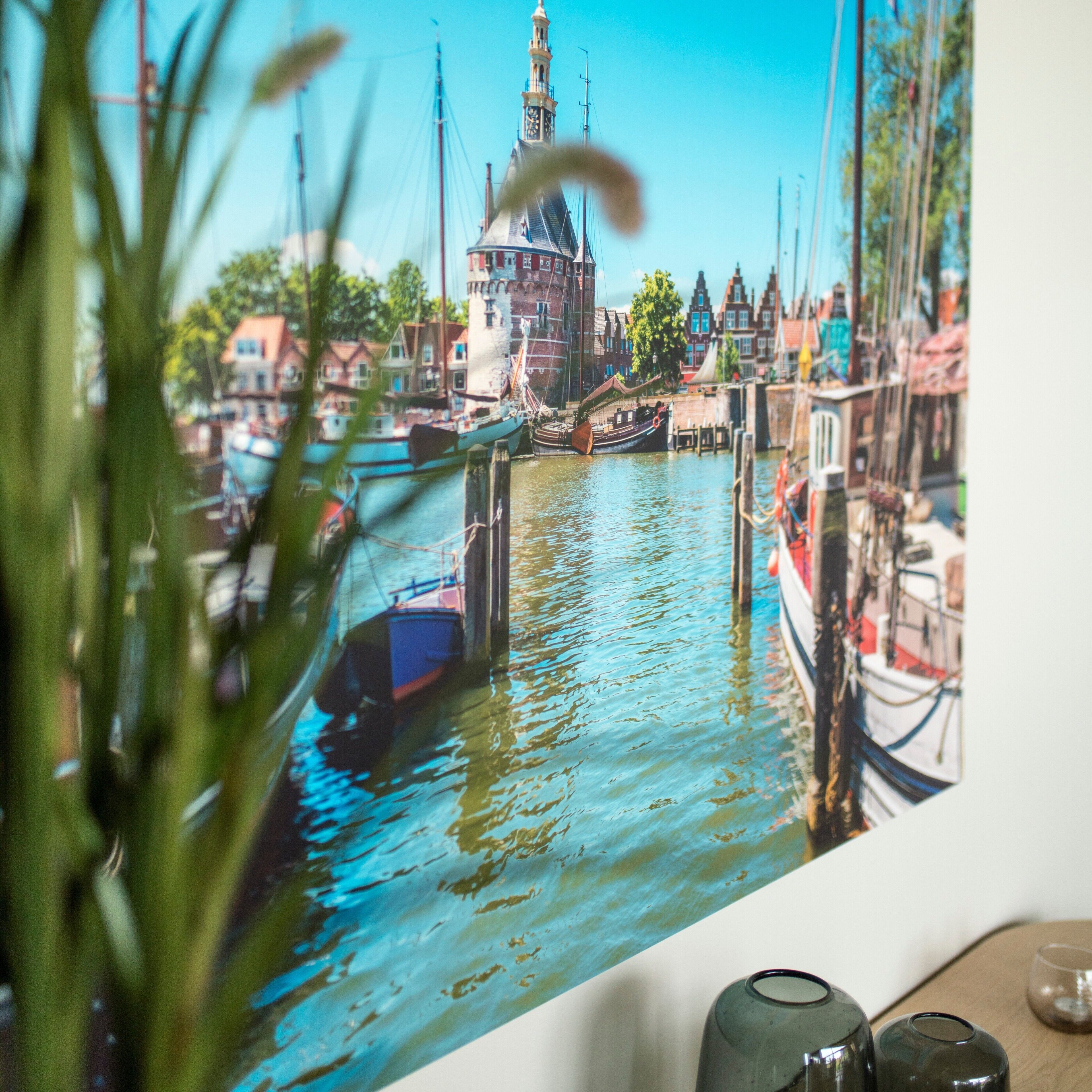 A view of a canal with boats and buildings.