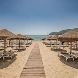 On the beach, sun-loungers, beach umbrellas, beach towels