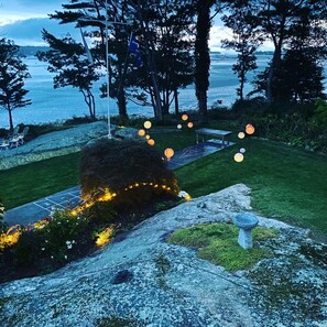 Relax on the lawn with a view of the serene body of water.