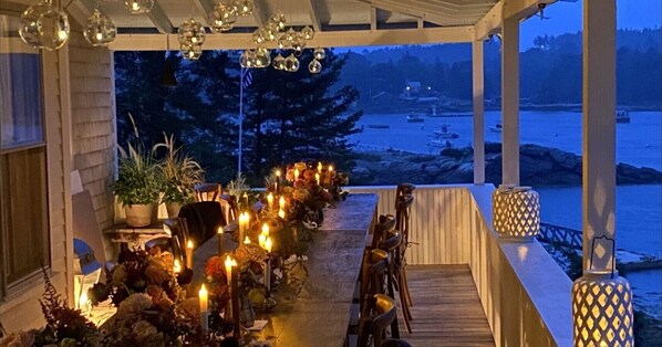 Enjoy dining or socializing in this inviting outdoor space with a waterfront view.