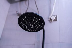 Hand-held showerhead - The Georges' Residence : Deluxe Single Room
(Kabale)