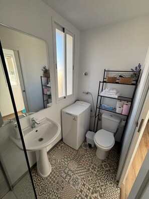 Shower, hair dryer, towels, soap