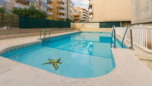 A swimming pool with a starfish design, surrounded by a concrete deck and metal railings. - Estornell With 2 Bedrooms and 1 Bathrooms (Daimuz)