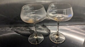 Two empty wine glasses on a reflective surface. - Cosy Coastal Apartment in Lytham St Anne's (Lytham St. Anne's)