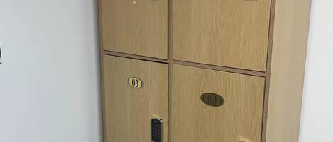 A six-drawer filing cabinet with numbered compartments, each with a lock.