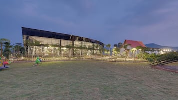 Situated near a lush green space, this building offers a unique blend of modern and traditional architecture.