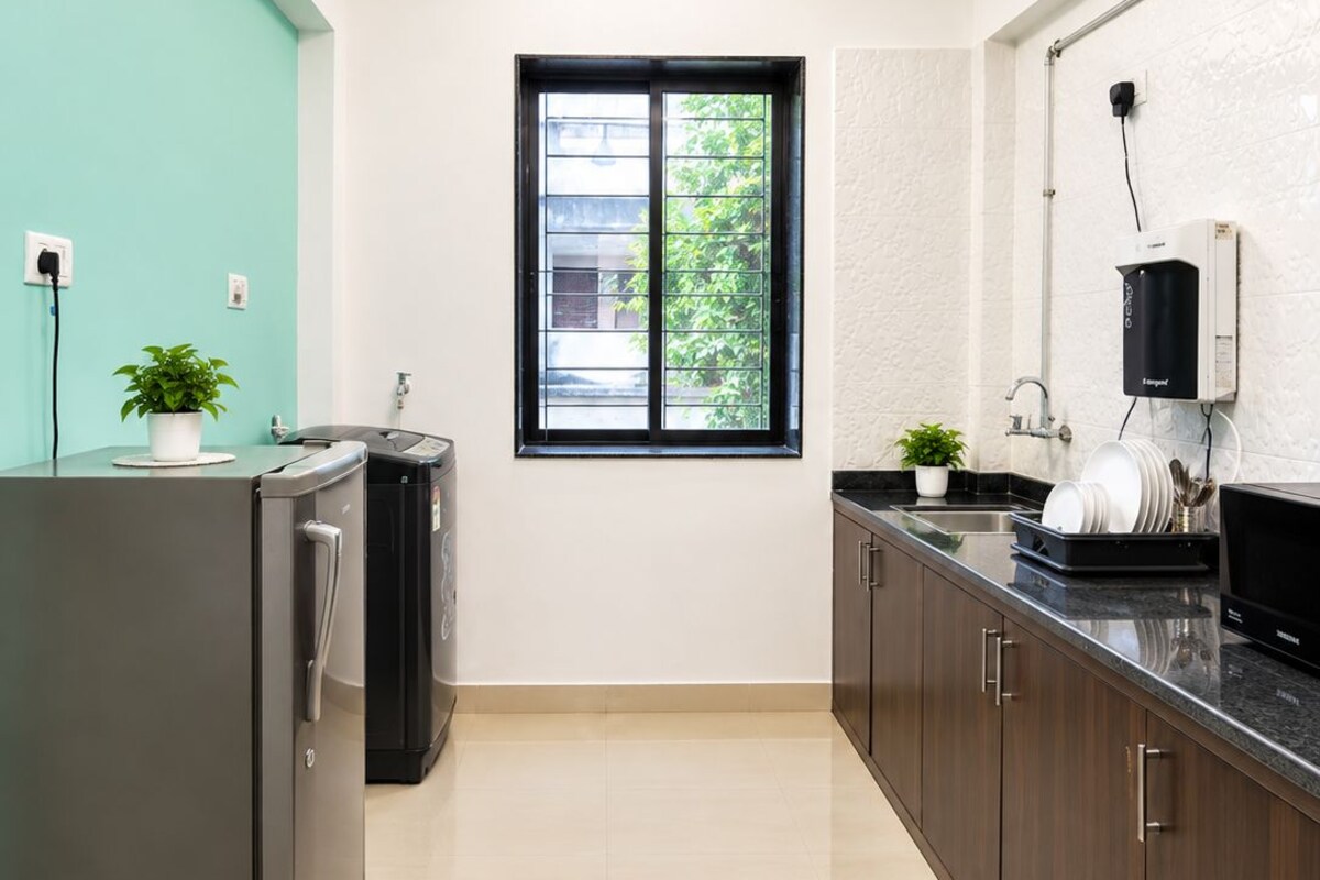 Premium Apartment, Garden View | Private kitchen | Full-size fridge, highchair, cleaning supplies, freezer