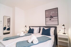 Apartment, 3 Bedrooms, Balcony | Desk, laptop workspace, soundproofing, iron/ironing board