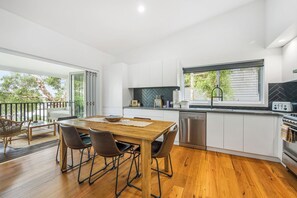 Fridge, stovetop, dishwasher, coffee/tea maker