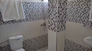 Shower, towels, soap, toilet paper