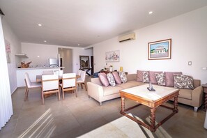 Deluxe Condo, Multiple Bedrooms, Kitchen, Partial Ocean View | Living area | 40-inch flat-screen TV with digital channels, Netflix