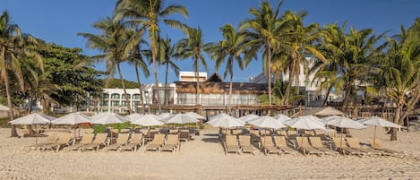 On the beach, white sand, free beach cabanas, sun-loungers