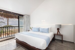Suite de lujo, 1 cama King size, baño privado, vista al mar | Ropa de cama de alta calidad y edredón 