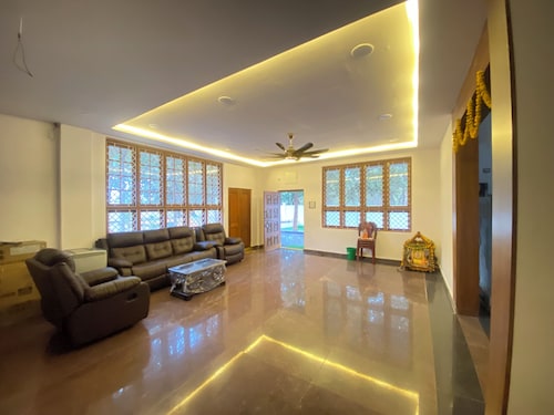 Charming 3-bedroom farmhouse in delightful Hyderabad with AC, Wi-Fi and pool.