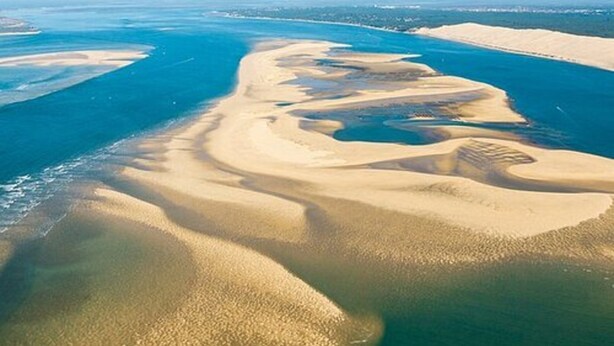 An aerial view of a coastal landscape with sand dunes and a body of water. - Villa in Agrigento Near Valley of the Temples (Agrigento)