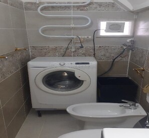 Hair dryer, bidet, towels, soap