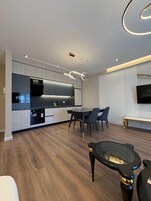 Superior Apartment, Balcony | Living area | 32-inch flat-screen TV with cable channels