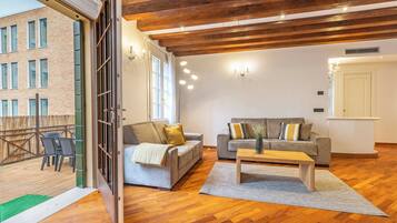 Appartement, vue lagon | Coin séjour | Télévision de 35 pouces avec chaßnes numériques