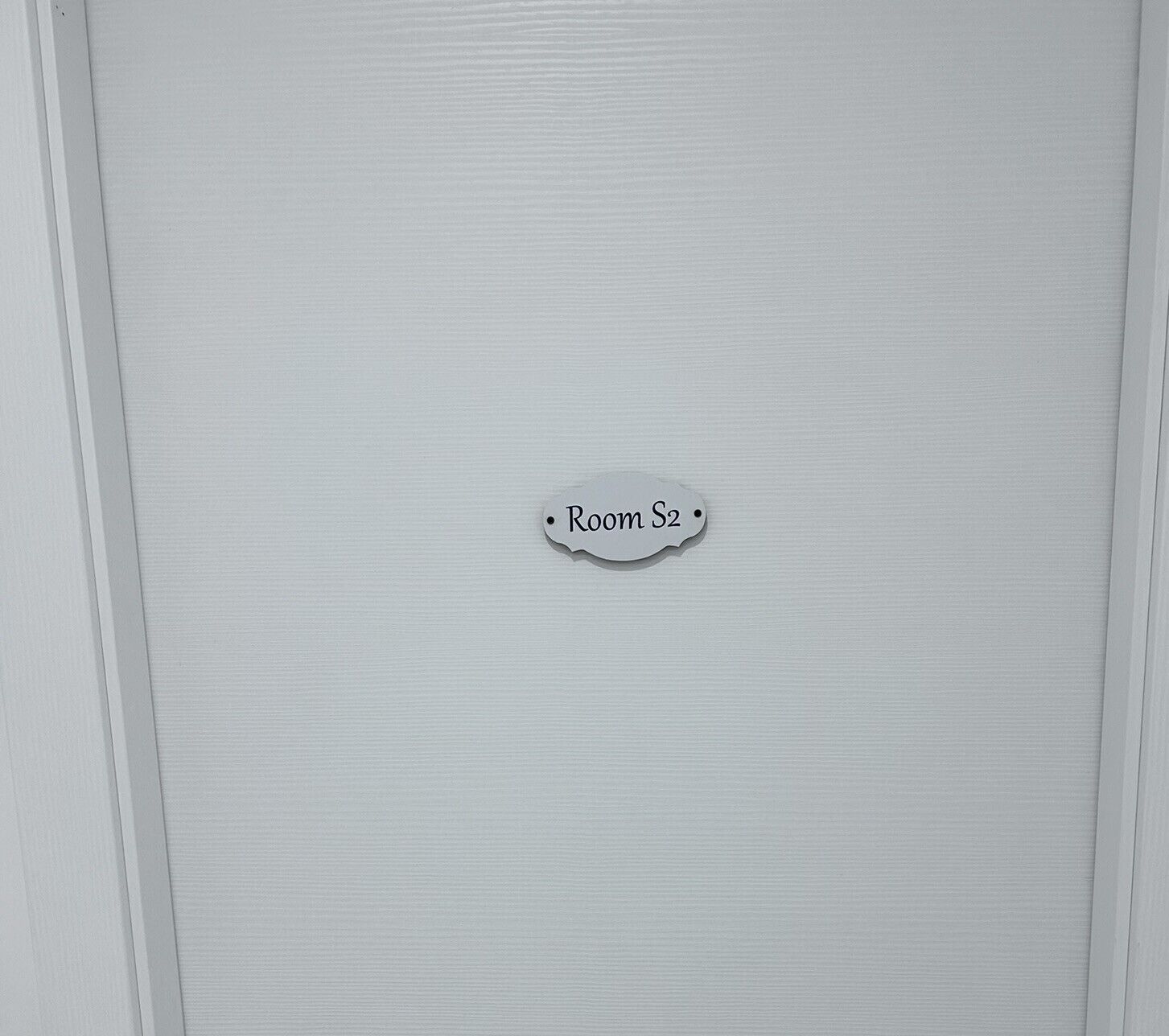 A door with a sign indicating "Room S2".
