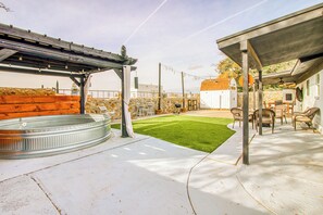A patio area with a hot tub, outdoor seating, and a pergola. - Space Cowboy
West El Paso, Tx (El Paso)