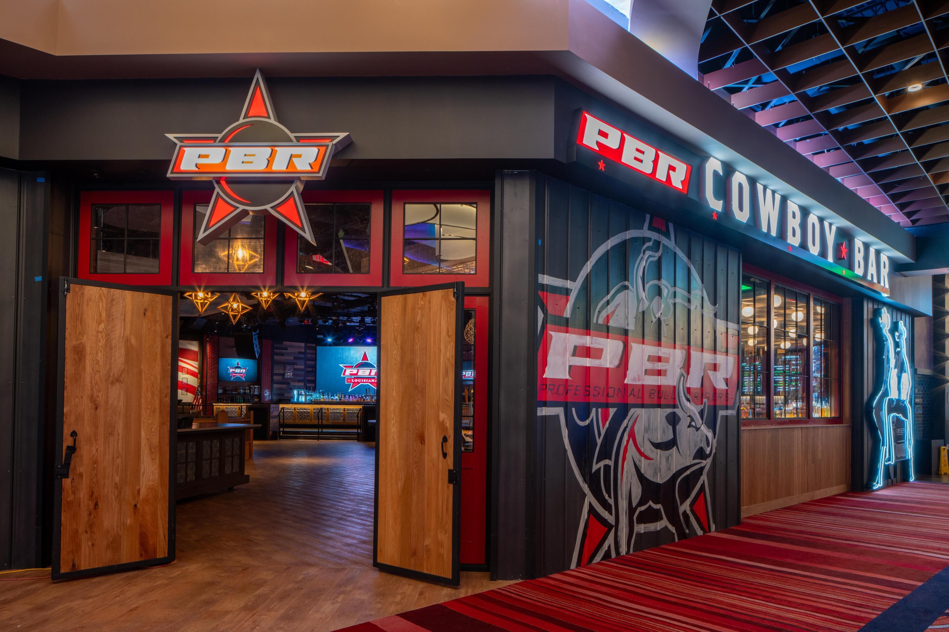 A PBR bar with a neon sign, wooden doors, and a red carpeted walkway.