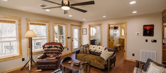 Beautiful Cabin Nestled in a Peaceful Wooded Setting with a Scenic Pond.