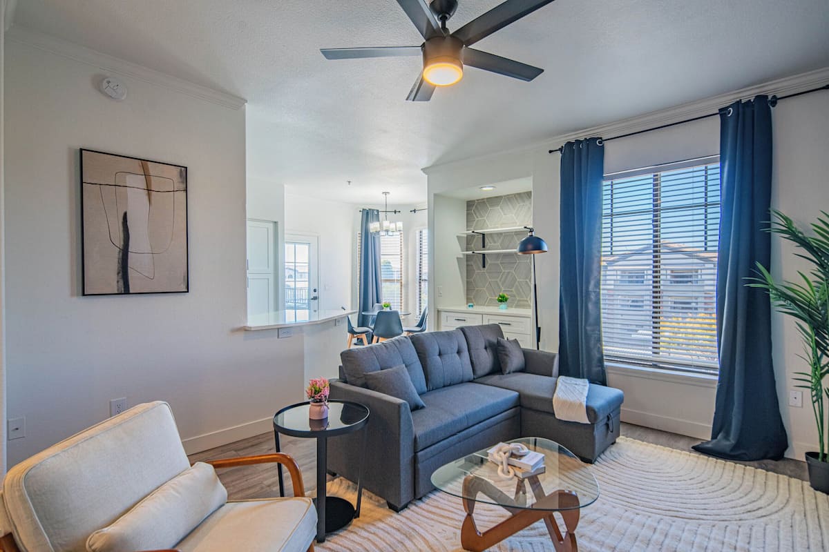Luxury Apartment, 2 Bedrooms, Refrigerator & Microwave | Living area | 55-inch Smart TV with digital channels