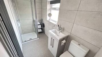 Shower, hair dryer, shampoo