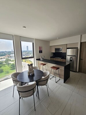 Fridge, microwave, stovetop, coffee/tea maker