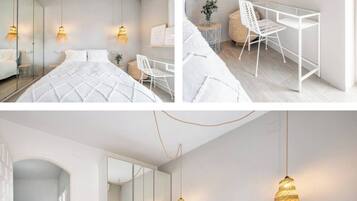 Relax in a serene bedroom with a large bed, flat-screen TV, and desk for work or study.
