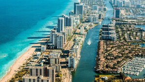 A coastal cityscape with high-rise buildings, a marina, and a beach. - Great Location Heated Pool near Hollywood Beach (Hollywood)