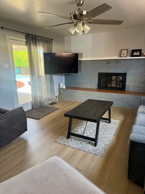 Smart TV, fireplace, books