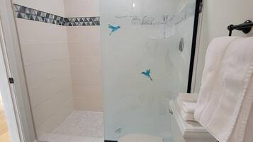 Shower, hair dryer, towels, soap