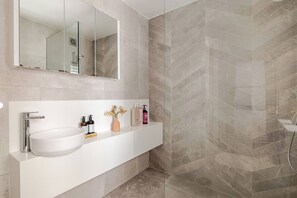 Shower, hair dryer, towels, soap