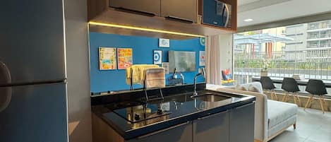 Apartment | Private kitchen | Fridge, microwave, stovetop, cookware/dishes/utensils
