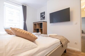 1 bedroom, desk, bed sheets