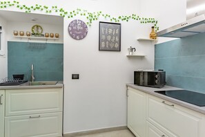 Fridge, microwave, stovetop, cookware/dishes/utensils