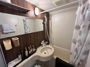 Eco-friendly toiletries, hair dryer, slippers, towels