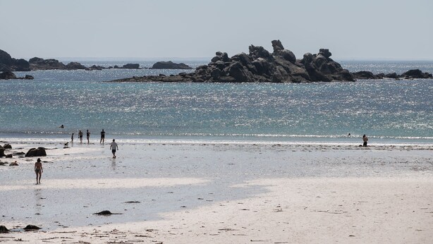 A beach with rocky formations and clear blue water. - La Grande Roche by Interhome (Porspoder)