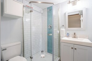 Shower, hair dryer, towels, soap