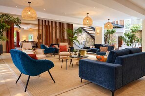 A spacious living area with modern furniture, a staircase, and large windows. - Luxurious residence for 30 people, with a pool and a large garden (Garrevaques)
