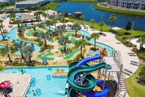 A resort with a large pool, water slides, and a golf course. - Home 6Bed , Themed Rooms, Game Room, Storey Lake (Kissimmee)