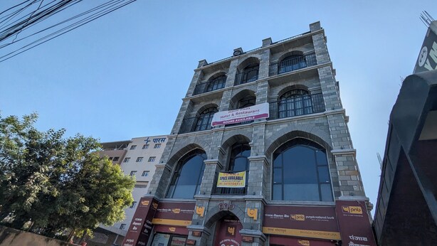 A multi-story building with a sign for 'Maria Rads Hotel & Restaurant' indicating rooms are available. - MAHA RAAS A Unit of RAAS LEELA Hotel  (Udaipur)