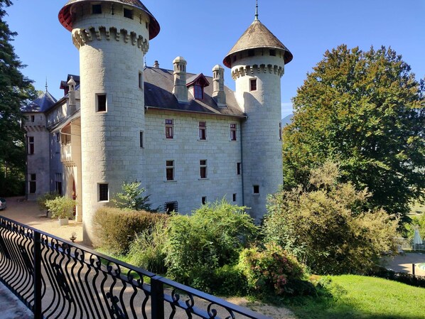 A castle-like building with multiple towers and a central courtyard.