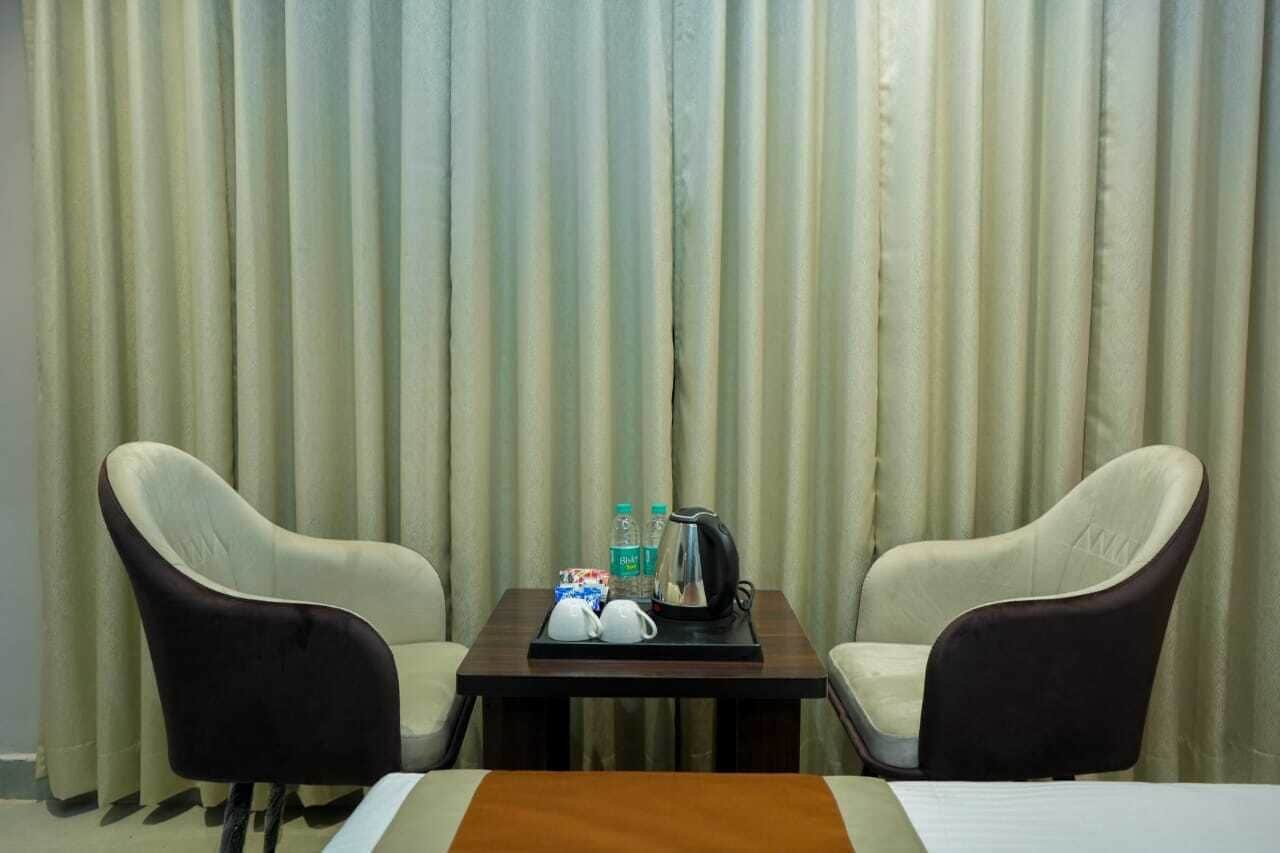 Deluxe kamer, 1 twee- of 2 eenpersoonsbedden | Woonruimte