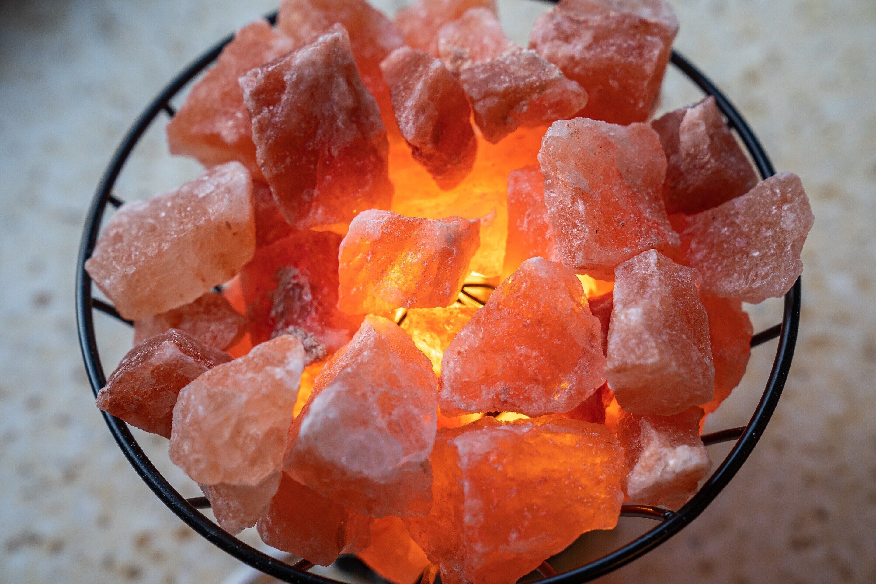 A bowl of pink Himalayan salt crystals.