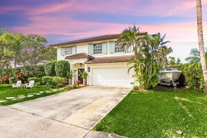 Enjoy a home away from home with a garage, lawn, and porch.
