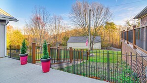 A fenced backyard with a wooden deck, a small shed, and a flagpole. - 2 Mi to Lake Cumberland Access: Home w/ Grill (Jamestown)